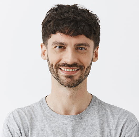 A smiling man in a T-shirt